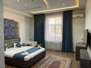 Ένα ή περισσότερα κρεβάτια σε δωμάτιο στο Vatan Hotel