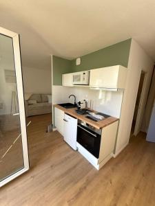 Η κουζίνα ή μικρή κουζίνα στο ღ Horizen - Studio neuf, cosy, proche plage
