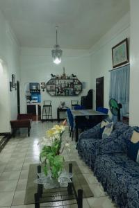 a living room with a couch and a table at Besañes Homestay in Alaminos