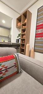 a room with a bed with a rug on it at Modern Omani Inspired Apartment in Muscat in Muscat