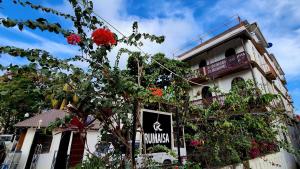 a building with a sign on the side of it at Rumaisa Hotel in Zanzibar City