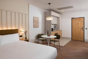 a bedroom with a bed and a table with chairs at master Wola in Warsaw