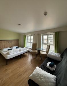 Postel nebo postele na pokoji v ubytování FOKA Hostel