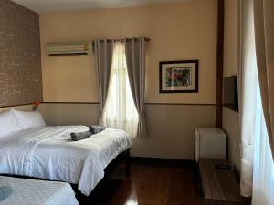 Postel nebo postele na pokoji v ubytování Noom Guesthouse