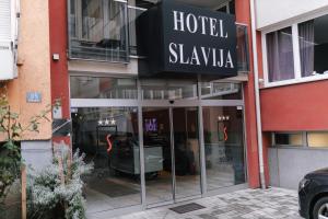 a hotel skylka entrance to a building with glass doors at Hotel Slavija Banja Luka in Banja Luka