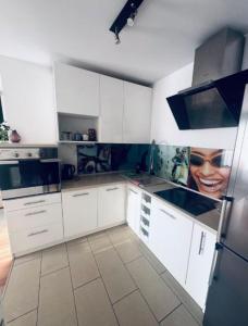 Kuchyň nebo kuchyňský kout v ubytování MD Neptun