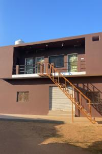 a building with a staircase on the side of it at Hari Har guest house in Chhatarpur