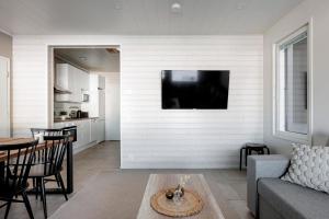 Μια τηλεόραση ή/και κέντρο ψυχαγωγίας στο Villa Hulvaton A - 12 hlö, Golf Resort +12 φωτογραφίες