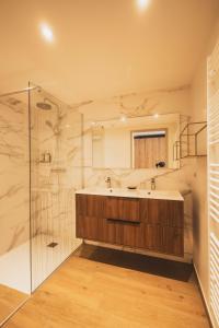 a bathroom with a tub and a glass shower at Villa Caroline, Lac d'Annecy in Duingt +73 photos