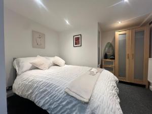 Ένα ή περισσότερα κρεβάτια σε δωμάτιο στο The Bluebird B&B I