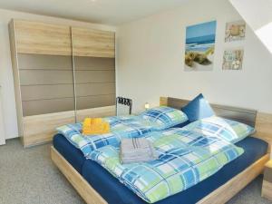 Postel nebo postele na pokoji v ubytování Wolke 7 von OstseeAhoi