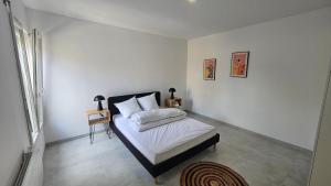 Ένα ή περισσότερα κρεβάτια σε δωμάτιο στο Maison 2 chambres, 6 couchages