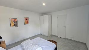 Ένα ή περισσότερα κρεβάτια σε δωμάτιο στο Maison 2 chambres, 6 couchages