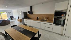 Η κουζίνα ή μικρή κουζίνα στο Maison 2 chambres, 6 couchages