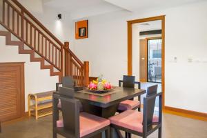 a dining room with a table and chairs at Luxury Pool Villa Laguna Resort Near Layan Beach - 2 bedrooms 6 people in Layan Beach