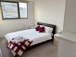 En eller flere senge i et værelse på Wembley Modern luxury 1 Bed, 5mins to stadium