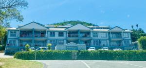 a large blue building with cars parked in front of it at Deja View in Knysna