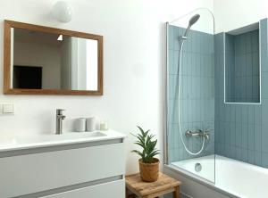 a bathroom with a sink and a shower at kremsoase in Krems an der Donau +40 photos