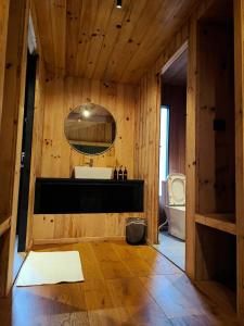 a bathroom with a sink and a mirror at The Himalayan Phakding in Phakding