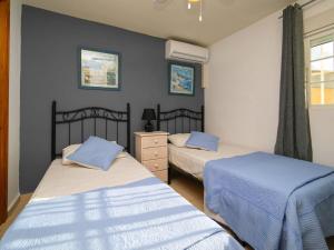 Ένα ή περισσότερα κρεβάτια σε δωμάτιο στο Holiday Home Villa Rosallia by Interhome