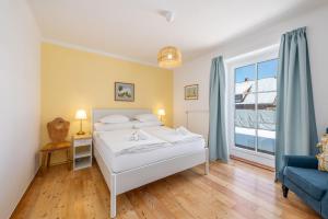 Postel nebo postele na pokoji v ubytování Alpine Zeitgeist Apartment - by myNests