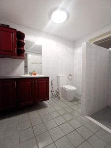 a bathroom with a sink and a toilet in it at Townhome 45 in Ban Nong Pru