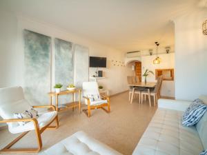 a living room with a couch and a table at Apartment Carabela Chic by Interhome in Alcudia