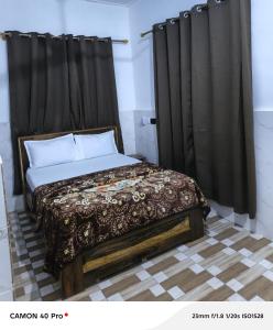 Ένα ή περισσότερα κρεβάτια σε δωμάτιο στο UniZone Guest House