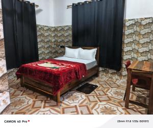 Ένα ή περισσότερα κρεβάτια σε δωμάτιο στο UniZone Guest House