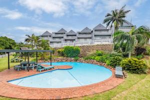 a swimming pool in front of a resort at 10 Gleneagles, Salt Rock in Ballito