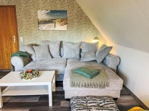 a living room with a couch and a table at Apartment Die Dorfperle by Interhome in Wanna