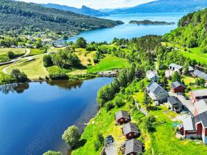 an aerial view of a village next to a lake at Apartment Samlen Vasselgård by Interhome in Herand