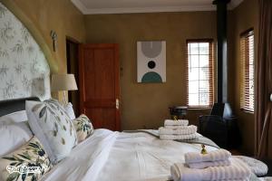 En eller flere senge i et værelse på Olive & Ivy Cherry Grove 7