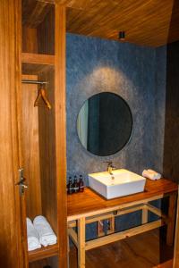 a bathroom with a sink and a mirror at The Himalayan Tyangboche in Thyāngboche +46 photos