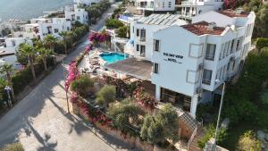 an aerial view of a city street with white buildings at The Bay View Hotel Kalkan in Kaş