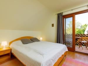 Ένα ή περισσότερα κρεβάτια σε δωμάτιο στο Apartment Nadori 2 by Interhome