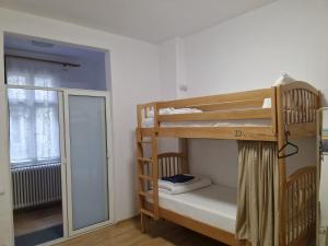 a room with two bunk beds and a window at Hostel Andrei in Iaşi