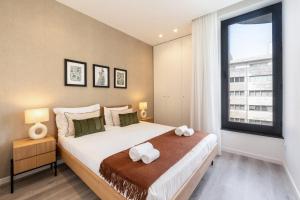 Ένα ή περισσότερα κρεβάτια σε δωμάτιο στο GuestReady - Peaceful retreat in Matosinhos