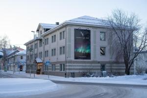 a building with a large poster on the side of it at Northern Light Hotel in Boden