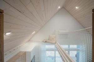 a room with a net in the ceiling at Modern Comfort - Spa - Mountain - Chalet ALBA in Saint Come