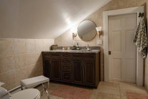 a bathroom with a sink and a mirror and a toilet at Historic Home near Stony Brook Village & Beach in Stony Brook +87 photos