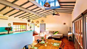 a living room with a table and a couch at Villa Solazur - ocean view in Bocas Town