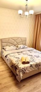 Giường trong phòng chung tại Апартаменты на Богомольца