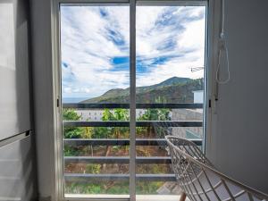 a room with a window with a view of the ocean at Live La Palma Lomo La Crucita in Lomo Machín