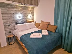 Ένα ή περισσότερα κρεβάτια σε δωμάτιο στο Andri Studio