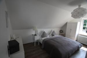 Giường trong phòng chung tại Haus mit Herz