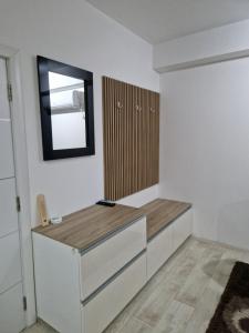 a room with a desk and a mirror on the wall at Diamond Apartment 2-Luxury in Strumica