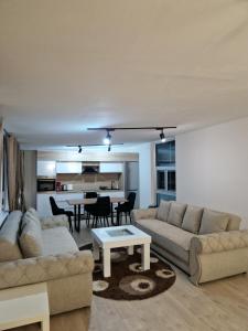 a living room with a couch and a table at Diamond Apartment 2-Luxury in Strumica