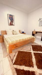 Postel nebo postele na pokoji v ubytování 4Zi Apartment 5 Min Flughafen, 10 Min Strand in Lomé + 14 fotografií