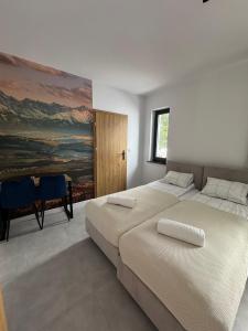 Postel nebo postele na pokoji v ubytování Pokoje nad Przełomem Dunajca - Wietrznice - Rivent Sport